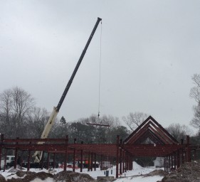 Crane moves beams